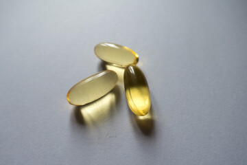 Macro of three capsules of oenothera oil