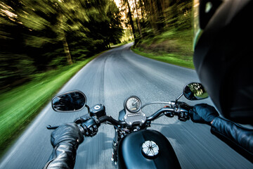 Fototapeta premium Man seat on the motorcycle on the forest road.