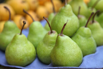 peer fruit in market stall