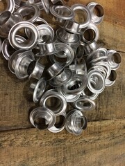 Silver Eyelet Ring on Wood Table