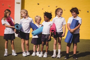 Obraz premium Schoolgirls interacting with each other 