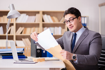 Businessman receiving letter in the office