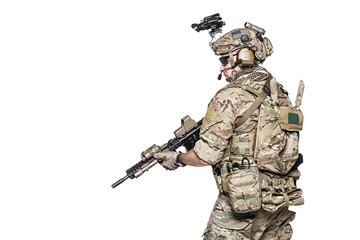 Fototapeta na wymiar Elite member of US Army rangers in combat uniforms with his shirt sleeves rolled up, in helmet, eyewear and night vision goggles. Studio shot, white background