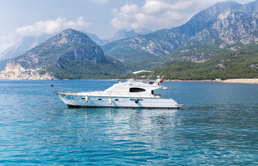 Fototapeta na wymiar Luxury yacht on turquoise water between the islands