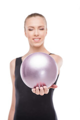 attractive rhythmic gymnast in bodysuit giving ball isolated on white