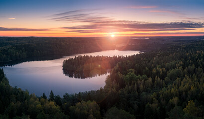 Naklejka na ściany i meble Scenic landscape with sunrise and lake at autumn in national park