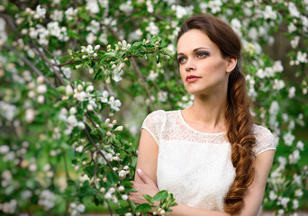 beautiful young girl with braided hair in the park.