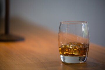 Close up of beer glass with ice cubes
