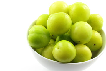 fresh turkish can erik plum fruits in a small white bowl