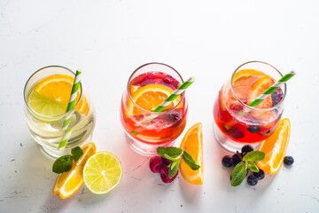 White, pink and red sangria with fruit