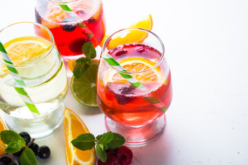 White, pink and red sangria with fruit