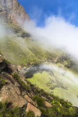 Fototapeta na wymiar Rainbow inside clouds on Sentinel Hike, Drakensberge, South Africa