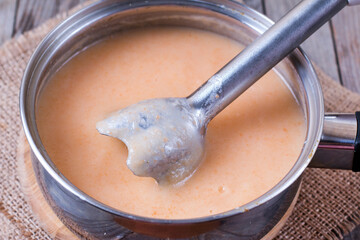Pumpkin puree on wooden background
