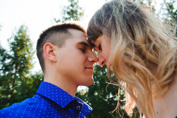 Fototapeta premium Portrait of young couple in love in a park
