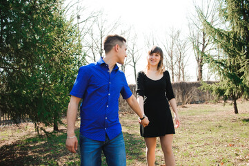 Obraz premium Portrait of young couple in love in a park