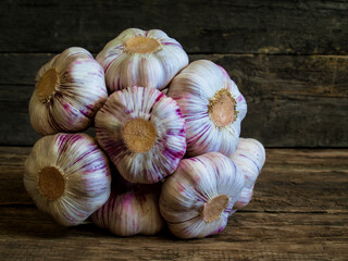 Garlic on wooden background violet garlic