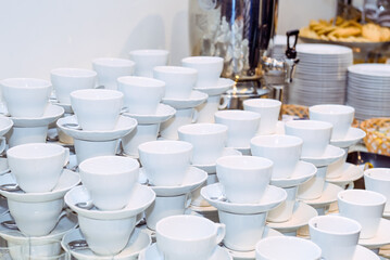 Catering table with dishes and snacks on the business event in the hotel hall. Close up, selective focus.