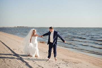 couple in love on the beach on their wedding day