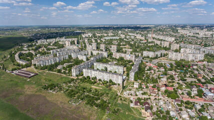 Obraz na płótnie Canvas Aerial shot of Kherson with splendid cityscape and cloudscape in summer