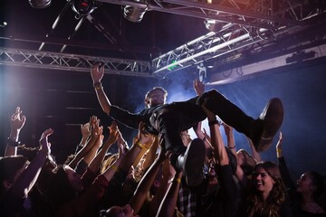 Crowd surfing at a concert