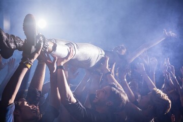 Crowd surfing at a concert