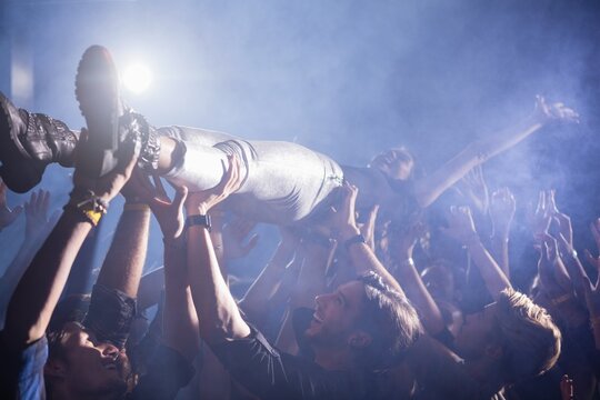 Crowd surfing at a concert