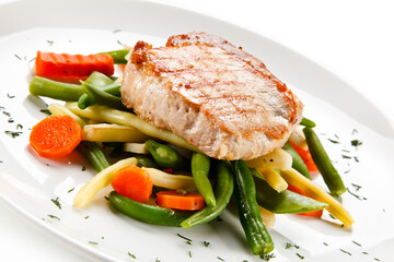 Roast steak with beans on white background
