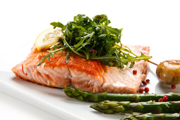 Grilled salmon with asparagus on white background