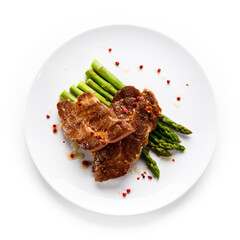 Grilled beefsteak with asparagus on white background