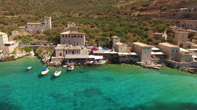 Aerial drone video of picturesque village of Limeni with clear waters, Mani, Peloponnese, Greece