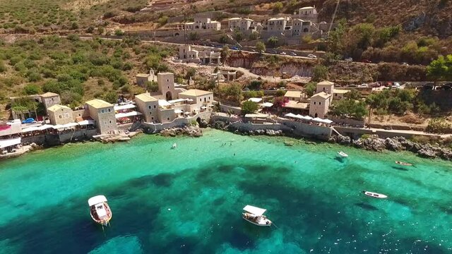 Aerial drone video of picturesque village of Limeni with clear waters, Mani, Peloponnese, Greece