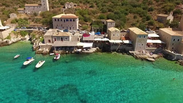 Aerial drone video of picturesque village of Limeni with clear waters, Mani, Peloponnese, Greece