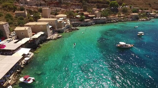 Aerial drone video of picturesque village of Limeni with clear waters, Mani, Peloponnese, Greece