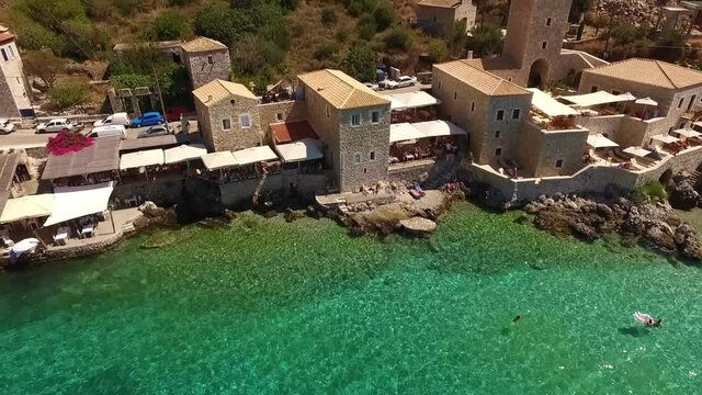 Aerial drone video of picturesque village of Limeni with clear waters, Mani, Peloponnese, Greece