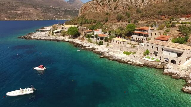 Aerial drone video of picturesque village of Limeni with clear waters, Mani, Peloponnese, Greece