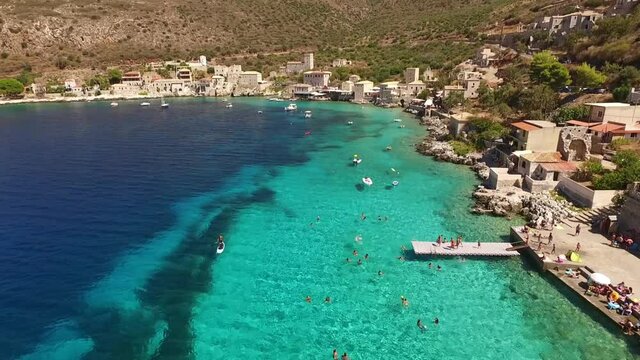Aerial drone video of picturesque village of Limeni with clear waters, Mani, Peloponnese, Greece