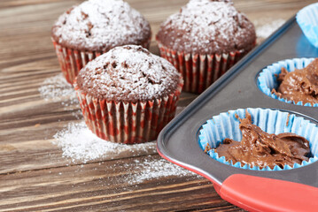 Сhocolate muffins with powdered sugar