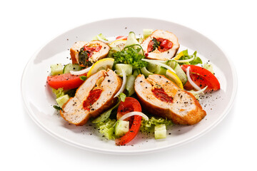 Salad with stuffed chicken fillet on white background
