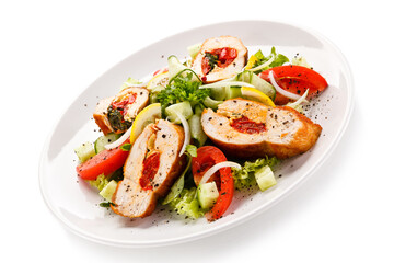 Salad with stuffed chicken fillet on white background