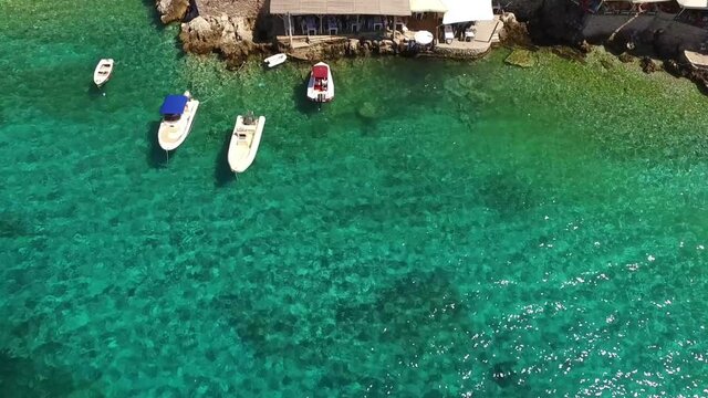 Aerial drone video of picturesque village of Limeni with clear waters, Mani, Peloponnese, Greece