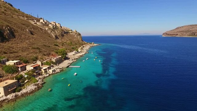 Aerial drone video of picturesque village of Limeni with clear waters, Mani, Peloponnese, Greece
