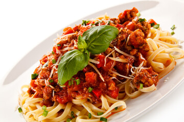 Pasta with bolognese sauce on white background