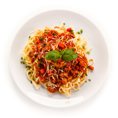 Pasta with bolognese sauce on white background