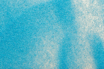 Abstract background of blue sand. Macro shot of blue sand