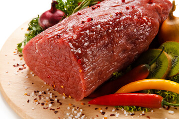 Fresh raw beef on cutting board on white background