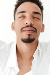 Fototapeta premium Handsome young african man isolated