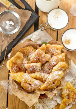 Sweet crisp pastry Angel wings with powdered sugar