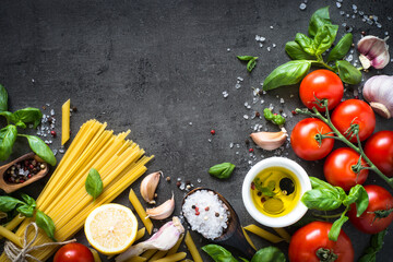 Ingredients for cooking pasta. Italian food background. Top view on black.