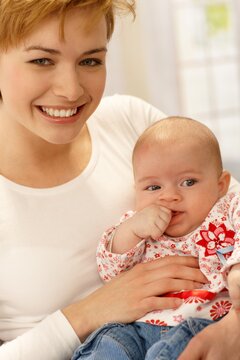 Closeup portrait of beautiful young mum and baby