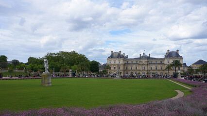 Fototapeta na wymiar Photo of Luxemburg gardens with beutiful clouds on a spring morning, Paris, France